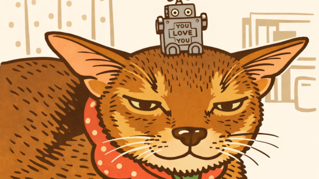 ほぼ日手帳のおまけを頭の上にのせているアビシニアン